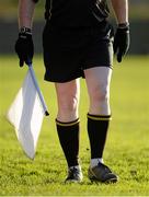 10 January 2015; An umpire wears gloves on a cold day while walking the sideline during the game. Waterford Crystal Cup Preliminary Round, Cork v University of Limerick, CIT GAA Grounds, Bishopstown, Co. Cork. Picture credit: Brendan Moran / SPORTSFILE