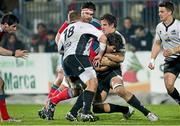 10 January 2015; Donnacha O'Callaghan, Munster, is tackled by Dario Chistolini  and Andries Van Schalkwyk, Zebre. Guinness PRO12 Round 13, Zebre v Munster, Stadio XXV Aprile, Parma, Italy. Picture credit: Roberto Bregani / SPORTSFILE