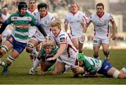 11 January 2015; Ulster's Stuart Olding is brought down by Benetton Treviso players. Guinness PRO12 Round 13, Benetton Treviso v Ulster, Stadio Monigo, Treviso, Italy. Picture credit: Roberto Bregani / SPORTSFILE