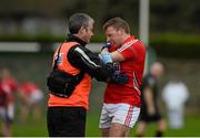 11 January 2015; Brian Hurley, Cork, receives treatment from physio Colin Lane after picking up an injury. McGrath Cup Quarter-Final, Tipperary v Cork, Clonmel Sportsfield, Clonmel, Co. Tipperary. Picture credit: Diarmuid Greene / SPORTSFILE