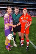 9 September 2007; Camogie captains Mary Leacy, Wexford, and Gemma O'Connor, Cork, shake hands in the company of referee John Morrissey. Gala All-Ireland Senior Camogie Final, Cork v Wexford, Croke Park, Dublin. Picture credit; Brian Lawless / SPORTSFILE