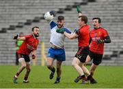11 January 2015; Thomas Connolly, Monaghan, in action against Conor Laverty, Brendan McArdle and Damian Turley, Down. Bank of Ireland Dr McKenna Cup, Group A, Round 2, Monaghan v Down, St Tiernach's Park, Clones, Co. Monaghan. Picture credit: Oliver McVeigh / SPORTSFILE