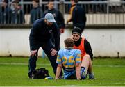 11 January 2015; UCD managerJohn Divilly checks on Tommy Moolick after he picked up an injury. Bord na Mona O'Byrne Cup, Group B, Round 3, Kildare v UCD. St Conleth's Park, Newbridge, Co. Kildare. Picture credit: Piaras Ó Mídheach / SPORTSFILE