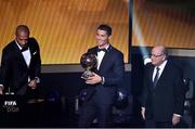 12 January 2015; Cristiano Ronaldo, Real Madrid and Portugal, centre, who was presented with he FIFA Ballon d'Or by former French international footballer theirry Henry, left, and FIFA President Sepp Blatter. FIFA Ballon D'Or 2014. Kongresshaus, Zurich, Switzerland. Picture credit: David Maher / SPORTSFILE