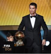 12 January 2015; Cristiano Ronaldo, Real Madrid and Portugal, with his son Cristiano Ronaldo Junior, after winning the FIFA Ballon d'Or. FIFA Ballon D'Or 2014. Kongresshaus, Zurich, Switzerland. Picture credit: David Maher / SPORTSFILE