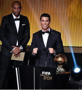 12 January 2015; Cristiano Ronaldo, Real Madrid and Portugal, celebrates after he was presented with the FIFA Ballon d'Or by former French international footballer theirry Henry. FIFA Ballon D'Or 2014. Kongresshaus, Zurich, Switzerland. Picture credit: David Maher / SPORTSFILE