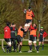 13 January 2015; Munster's Peter O'Mahony, lifted by team-mates BJ Botha, left, and CJ Stander, wins possession from a lineout during squad training ahead of their European Rugby Champions Cup 2014/15, Pool 1, Round 5, match against Saracens on Saturday. Munster Rugby Squad Training, University of Limerick, Limerick. Picture credit: Diarmuid Greene / SPORTSFILE
