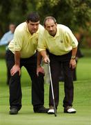 13 September 2007; Tony Lawlor and his caddy Brendan McMahon, left, Woodstock G.C., Ennis, Clare, line up a putt on the 13th during the Bulmers Pierce Purcell Shield Semi-Finals. Bulmers Cups and Shields Finals 2007, Shandon Park Golf Club, Belfast, Co. Antrim. Picture credit: Ray McManus / SPORTSFILE