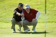 14 September 2007; Jim Carvill and his caddy Declan Barry, Banbridge G.C., Down, line up a putt on the 5th during the Magners Senior Cup Semi-Finals. Magners Cups and Shields Finals 2007, Shandon Park Golf Club, Belfast, Co. Antrim. Picture credit: Ray McManus / SPORTSFILE