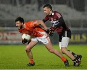 14 January 2015; Stefan Forker, Armagh, in action against Matt Fitzpatrick, St Mary's University College. Bank of Ireland Dr McKenna Cup, Group B, Round 3, Armagh v St Mary's University College. Athletic Grounds, Armagh. Picture credit: Oliver McVeigh / SPORTSFILE