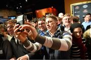 16 January 2015; Norman Parke takes a selfie with fans during a media day ahead of his fight against Gleison Tibau in TD Garden, Boston, on Sunday. UFC Fight Night Ultimate Media Day, Ned Devine’s Irish Pub, Boston, Massachusetts, USA. Picture credit: Ramsey Cardy / SPORTSFILE