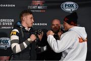 16 January 2015; Norman Parke, left, faces off with Gleison Tibau ahead of their fight in TD Garden, Boston, on Sunday. UFC Fight Night Ultimate Media Day, Ned Devine’s Irish Pub, Boston, Massachusetts, USA. Picture credit: Ramsey Cardy / SPORTSFILE