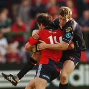 22 September 2007; Ian Dowling, Munster, is tackled by Gavin Evans, Llanelli Scarlets. Magners League, Munster v Llanelli Scarlets, Musgrave Park, Cork. Picture credit; Paul Mohan / SPORTSFILE