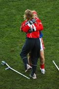 23 September 2007; Cork goalkeeper Elaine Harte, right, celebrates with her injured team-mate Mary O'Connor at the end of the game. TG4 All-Ireland Ladies Senior Football Championship Final, Cork v Mayo, Croke Park, Dublin. Picture credit; David Maher / SPORTSFILE