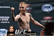 17 January 2015; Paddy Holohan weighs in ahead of his fight against Shane Howell in TD Garden, Boston, on Sunday. UFC Fight Night Weigh-in, Orpheum Theatre, Boston, Massachusetts, USA. Picture credit: Ramsey Cardy / SPORTSFILE