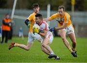 18 January 2015; Tiernan McCann, Tyrone, in action against Michael Pollock, Antrim. Bank of Ireland Dr McKenna Cup, Group C, Round 3, Tyrone v Antrim, St. Tiernach's Park, Clones, Co. Tyrone. Picture credit: Oliver McVeigh / SPORTSFILE