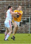 18 January 2015; Michael Pollock, Antrim, in action against Aiden McCrory, Tyrone. Bank of Ireland Dr McKenna Cup, Group C, Round 3, Tyrone v Antrim, St. Tiernach's Park, Clones, Co. Tyrone. Picture credit: Oliver McVeigh / SPORTSFILE