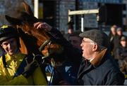 18 January 2015; Trainer Ted Walsh congratulates  Foxrock and jockey Adrian Heskin after winning the BoyleSports Handicap Steeplechase. Leopardstown, Co. Dublin. Picture credit: Barry Cregg / SPORTSFILE