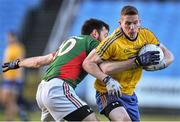 18 January 2015; Sean McDermott, Roscommon, in action against Kevin McLoughlin, Mayo. FBD League, Section A, Round 3, Mayo v Roscommon, Elverys MacHale Park, Castlebar, Co. Mayo. Picture credit: David Maher / SPORTSFILE