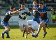 18 January 2015; Ollie Lyons, Kildare, in action against Eoin Fletcher, left, and Shane Dowling, DIT. Bord na Mona O'Byrne Cup, Semi-Final, Kildare v DIT. St Conleth's Park, Newbridge, Co. Kildare. Picture credit: Piaras Ó Mídheach / SPORTSFILE