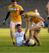 18 January 2015; PJ Lavery, Tyrone, in action against Conor Murray and Connor Burke, Antrim. Bank of Ireland Dr McKenna Cup, Group C, Round 3, Tyrone v Antrim, St. Tiernach's Park, Clones, Co. Tyrone. Picture credit: Oliver McVeigh / SPORTSFILE
