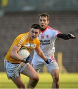 18 January 2015; Connor Burke, Antrim, in action against Mark Donnelly, Tyrone. Bank of Ireland Dr McKenna Cup, Group C, Round 3, Tyrone v Antrim, St. Tiernach's Park, Clones, Co. Tyrone. Picture credit: Oliver McVeigh / SPORTSFILE