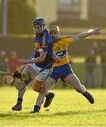 18 January 2015; Tom Stapleton, Tipperary, in action against John Conlon, Clare. Waterford Crystal Cup, Quarter-Final, Clare v Tipperary, O'Garney Park, Sixmilebridge, Co. Clare. Picture credit: Diarmuid Greene / SPORTSFILE
