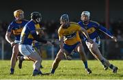 18 January 2015; Conor Ryan, Clare, in action against  Tipperary's Ronan Maher, left, Michael Butler, and Brendan Maher, right. Waterford Crystal Cup, Quarter-Final, Clare v Tipperary, O'Garney Park, Sixmilebridge, Co. Clare. Picture credit: Diarmuid Greene / SPORTSFILE