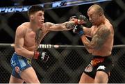 18 January 2015; Norman Parke, left, in action against Gleison Tibau during their lightweight bout. UFC Fight Night, Norman Parke v Gleison Tibau, TD Garden, Boston, Massachusetts, USA. Picture credit: Ramsey Cardy / SPORTSFILE