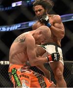 18 January 2015; Benson Henderson,right, lands a right knee on Donald Cerrone during their lightweight bout. UFC Fight Night, Donald Cerrone v Benson Henderson, TD Garden, Boston, Massachusetts, USA. Picture credit: Ramsey Cardy / SPORTSFILE
