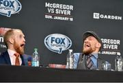 18 January 2015; Paddy Holohan, left, and Conor McGregor share a joke during a post-fight press conference. UFC Fight Night, Conor McGregor v Dennis Siver, TD Garden, Boston, Massachusetts, USA. Picture credit: Ramsey Cardy / SPORTSFILE