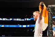18 January 2015; Paddy Holohan leaves the octagon after defeating Shane Howell in their flyweight bout. UFC Fight Night, Paddy Holohan v Shane Howell, TD Garden, Boston, Massachusetts, USA. Picture credit: Ramsey Cardy / SPORTSFILE