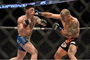 18 January 2015; Norman Parke, left, in action against Gleison Tibau during their lightweight bout. UFC Fight Night, Norman Parke v Gleison Tibau, TD Garden, Boston, Massachusetts, USA. Picture credit: Ramsey Cardy / SPORTSFILE