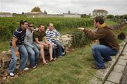 26 September 2007; Irish prop Marcus Horan, right, organises team-mates, from left, David Wallace, Gordon D'Arcy, Malcolm O'Kelly, and Frankie Sheahan for a photograph on a visit to the famous vineyards of Saint-Emilion in the south of France during a rest day ahead of their Pool D game against Argentina on Sunday next. Saint Emilion, France. Picture credit: Brendan Moran / SPORTSFILE