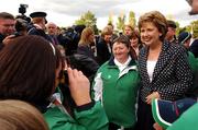 26 September 2007; President Mary McAleese poses for photographs with Special Olympic athletes at a ceremony to mark the final leg of the Irish Law Enforcement Torch Run Ceremony in aid of Special Olympics Ireland. This event is the final send off for TEAM Ireland before they depart for the Special Olympics World Summer Games. The 2007 Special Olympics World Summer Games will take place in Shanghai, China from 2nd October 2007 to the 11th October 2007. Westmanstown, Dublin. Picture credit: David Maher / SPORTSFILE