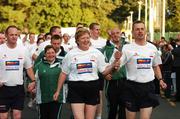 26 September 2007; Pauline Crompton, PSNI, and Pat Merrick, Garda, carry the torch at a ceremony to mark the final leg of the Irish Law Enforcement Torch Run Ceremony in aid of Special Olympics Ireland. This event is the final send off for TEAM Ireland before they depart for the Special Olympics World Summer Games. The 2007 Special Olympics World Summer Games will take place in Shanghai, China from 2nd October 2007 to the 11th October 2007. Westmanstown, Dublin. Picture credit: David Maher / SPORTSFILE