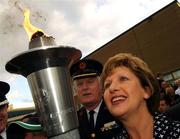26 September 2007; President Mary McAleese holds the torch at a ceremony to mark the final leg of the Irish Law Enforcement Torch Run Ceremony in aid of Special Olympics Ireland. This event is the final send off for TEAM Ireland before they depart for the Special Olympics World Summer Games. The 2007 Special Olympics World Summer Games will take place in Shanghai, China from 2nd October 2007 to the 11th October 2007. Westmanstown, Dublin. Picture credit: David Maher / SPORTSFILE