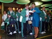 27 September 2007; On their way!: Aer Lingus hostess Val Denotti checks passports prior to boarding Aer Lingus sponsored flight to London Heathrow en route to the Special Olympics World Summer Games. The 2007 Special Olympics World Summer Games will take place in Shanghai from the 2nd October to the 11th October 2007. Ireland will be represented by a team of 143 athletes and 55 coaches who will participate in 11 sports. Dublin Airport, Dublin. Picture credit: Caroline Quinn / SPORTSFILE