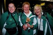 27 September 2007; On their way!: 5 a-side soccer team members, from left, Bridgid O'Reilly, Dublin, and Kathleen McMeel, Limerick, with coach Collette O'Connor, Kildare, and team mascot 'ShangLow' at Dublin Airport prior to boarding Aer Lingus sponsored flight to London Heathrow en route to the the Special Olympics World Summer Games. The 2007 Special Olympics World Summer Games will take place in Shanghai from the 2nd October to the 11th October 2007. Ireland will be represented by a team of 143 athletes and 55 coaches who will participate in 11 sports. Dublin Airport, Dublin. Picture credit: Caroline Quinn / SPORTSFILE