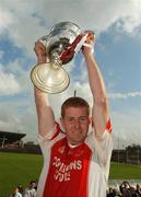30 September 2007; Tom Earley, Ballintubber, lifts the cup. TF Royal Hotel and Theatre Mayo Intermediate Football Championship Final, Ballintubber v Kiltimagh, McHale Park, Castlebar, Co. Mayo. Picture credit; Pat Murphy / SPORTSFILE *** Local Caption ***