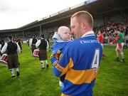 30 September 2007; Dromard captain Padraig Jones holds his four month old baby son, Killian, during the parades of the two teams. Longford Senior Football Championship Final, Dromard v Colmcille, Pearse Park, Longford. Picture credit; David Maher / SPORTSFILE