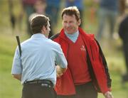 30 September 2007; GB&I team captain Nick Faldo congratulates Bradley Dredge on the 18th green after winning his game against Gonzalo Fdez-Castano. The Seve Trophy, Singles, The Heritage Golf & Spa Resort, Killenard, Co. Laois. Picture credit: Matt Browne / SPORTSFILE