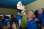 30 September 2007; Sean Hagan, Dromard head coach, lifts his son Joseph in their team dressing room at the end of the game. Longford Senior Football Championship Final, Dromard v Colmcille, Pearse Park, Longford. Picture credit; David Maher / SPORTSFILE
