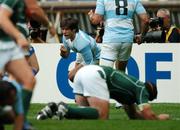 30 September 2007; Lucas Borges, Argentina, celebrates scoring his side's first try as Ireland's Denis Leamy lies dejected. 2007 Rugby World Cup, Pool D, Ireland v Argentina, Parc des Princes, Paris, France. Picture credit; Brendan Moran / SPORTSFILE