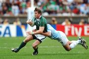 30 September 2007; Brian O'Driscoll, Ireland, is tackled by Manuel Contepomi, Argentina. 2007 Rugby World Cup, Pool D, Ireland v Argentina, Parc des Princes, Paris, France. Picture credit; Brian Lawless / SPORTSFILE