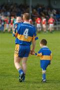 30 September 2007; Padraig Jones, captain of Dromard, holds his four month old baby son, Killian, before the parades of the two teams. Longford Senior Football Championship Final, Dromard v Colmcille, Pearse Park, Longford. Picture credit; David Maher / SPORTSFILE