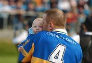 30 September 2007; Padraig Jones, captain of Dromard, holds his four month old baby son, Killian, during the parades of the two teams. Longford Senior Football Championship Final, Dromard v Colmcille, Pearse Park, Longford. Picture credit; David Maher / SPORTSFILE