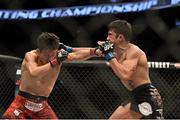 18 January 2015; Tateki Matsuda, left, in action against Joby Sanchez during their flyweight bout. UFC Fight Night, Tateki Matsuda v Joby Sanchez, TD Garden, Boston, Massachusetts, USA. Picture credit: Ramsey Cardy / SPORTSFILE