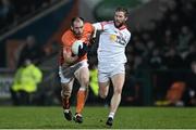 21 January 2015; Ciaran McKeever, Armagh, in action against Peter Hughes, Tyrone. Dr. McKenna Cup Semi-Final, Armagh v Tyrone. Athletic Grounds, Armagh. Picture credit: Ramsey Cardy / SPORTSFILE