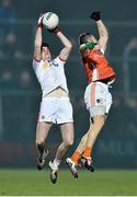 21 January 2015; Conal McCann, Tyrone, in action against Mark Shields, Armagh. Dr. McKenna Cup Semi-Final, Armagh v Tyrone. Athletic Grounds, Armagh. Picture credit: Ramsey Cardy / SPORTSFILE